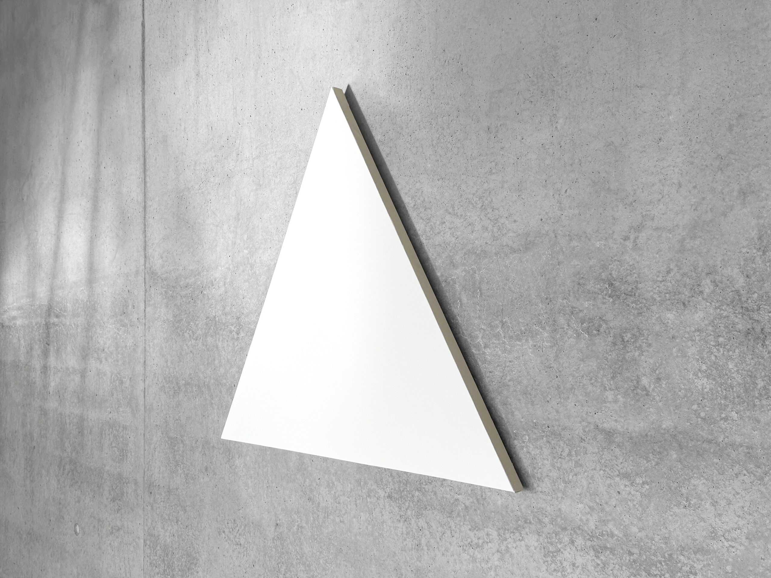 Side angle view of Jean-Charles Kien's white triangular shaped canvas artwork mounted on a gray concrete wall
