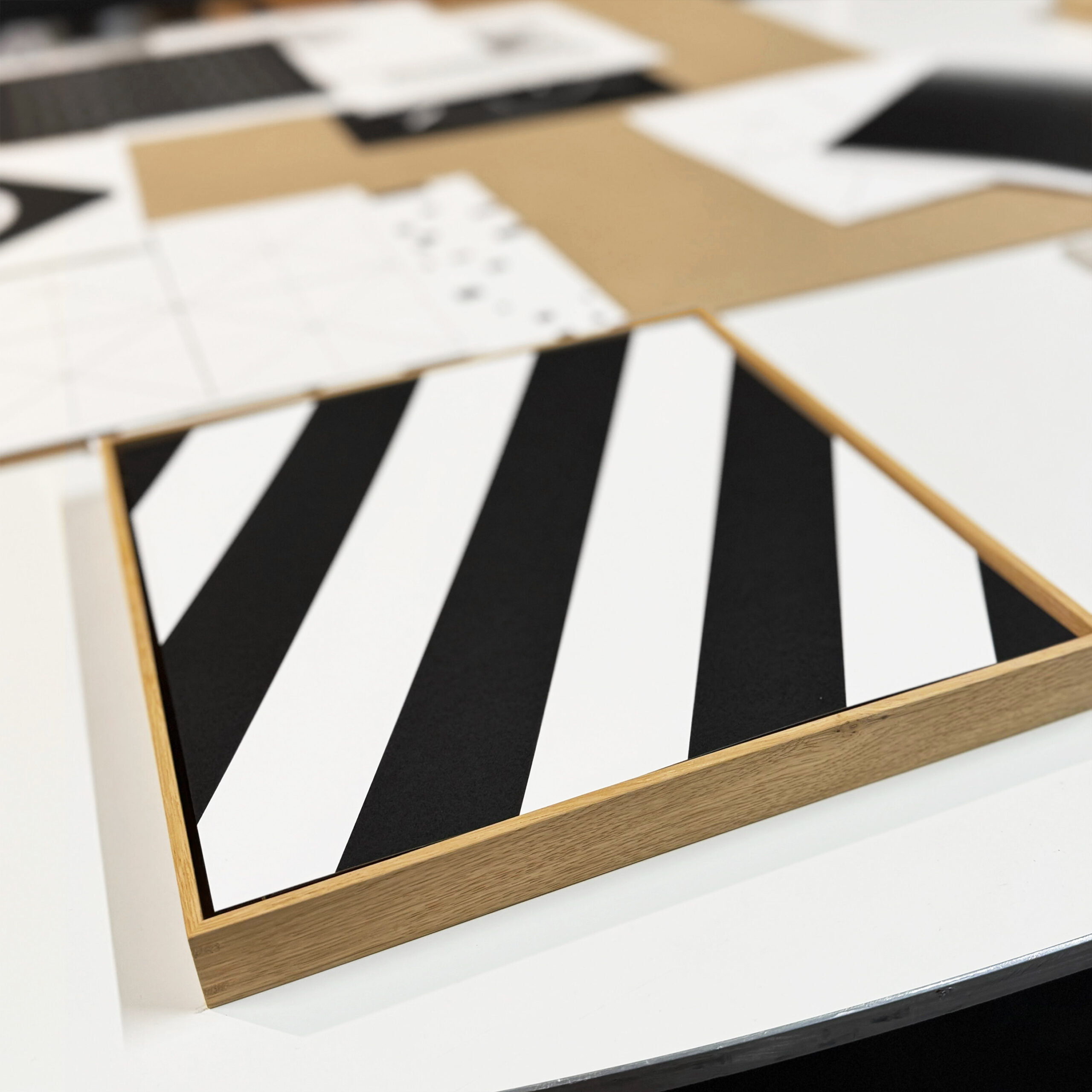 Studio view of Jean-Charles Kien's square artwork with diagonal stripes, prepared for the 0,0,0 abstract art portfolio