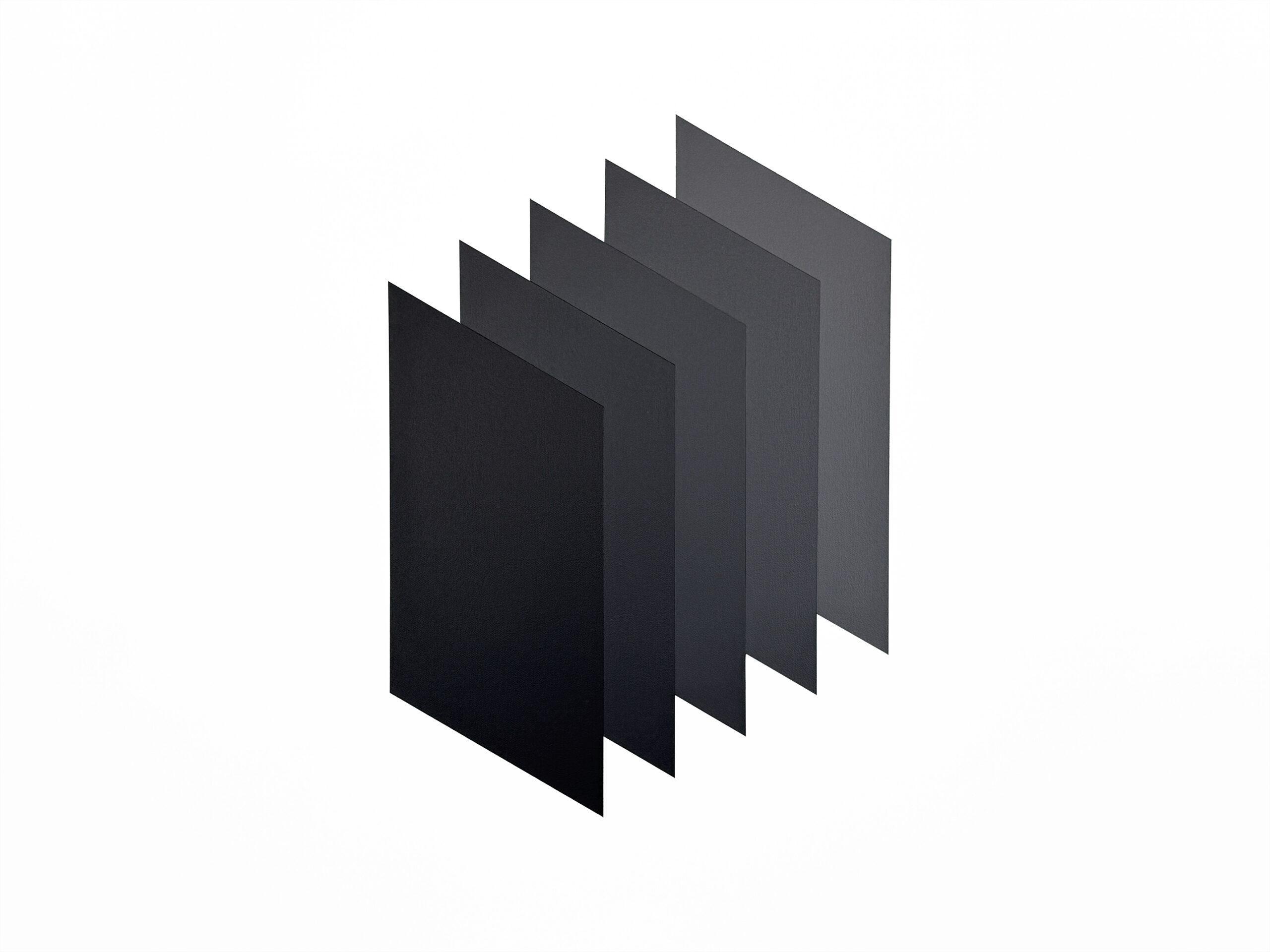 Angled close-up of ISGP showing the sharp edges and isometric perspective of six color planes, illustrating a subtle tonal gradient from intense black to medium gray.
