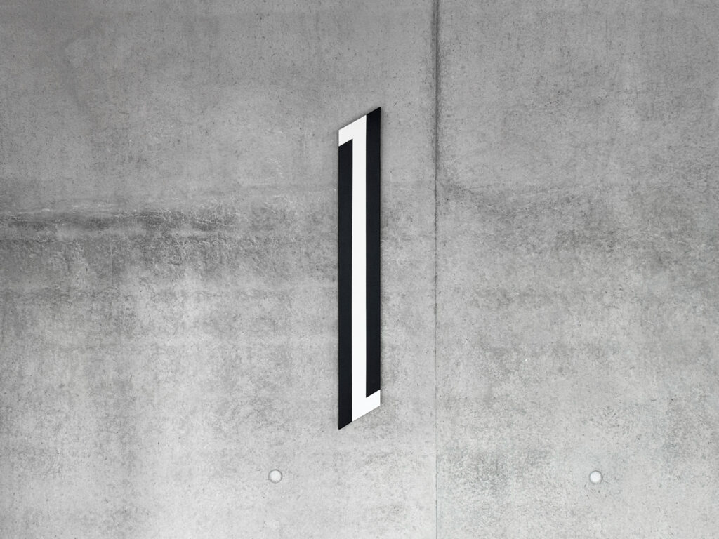 Elongated vertical geometric painting by Jean-Charles Kien featuring three vertical bands on a raw concrete background.