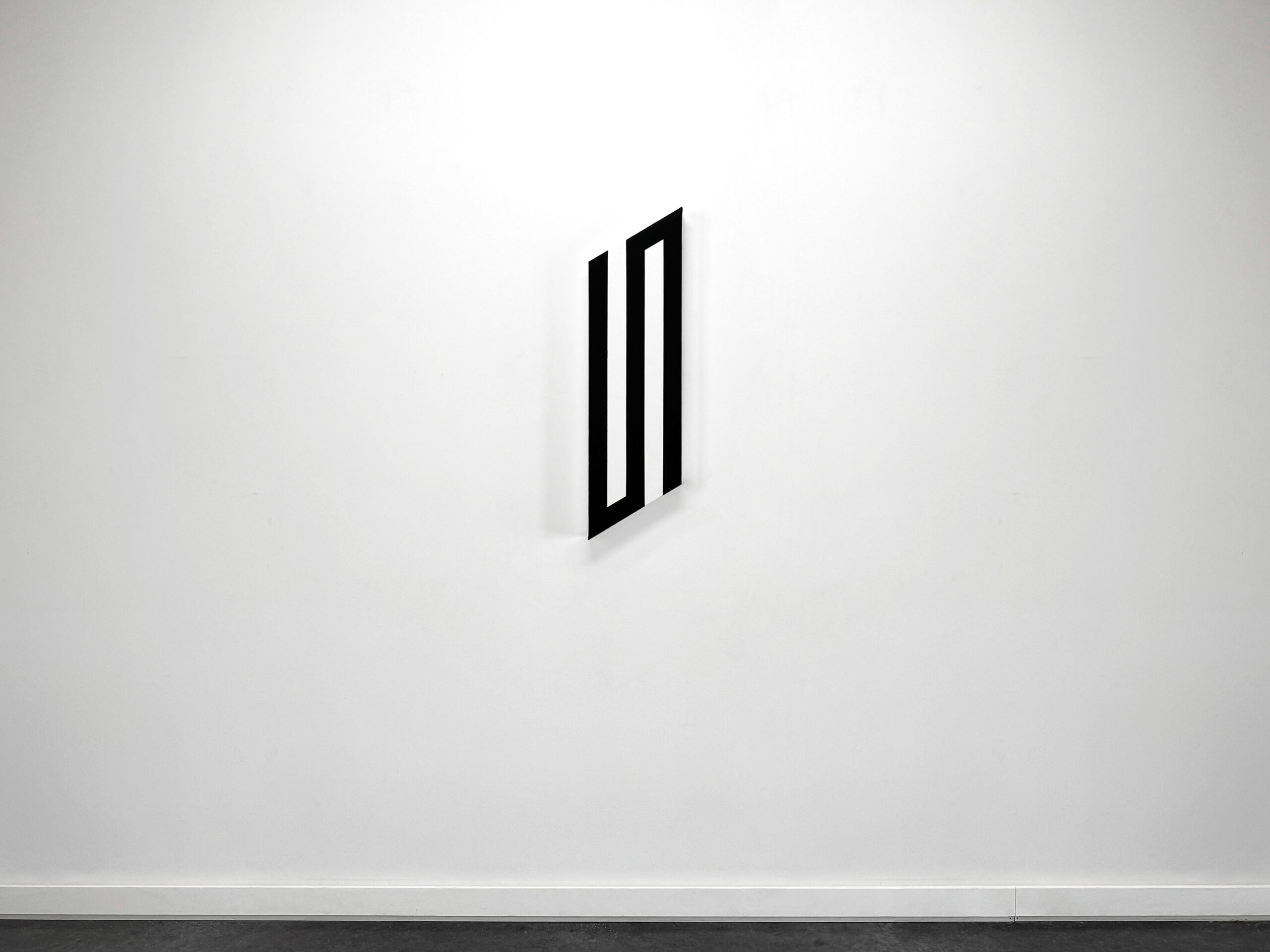 Elongated vertical shaped canvas painting by Jean-Charles Kien featuring an interlinked S shaped geometric structure on a gallery wall.