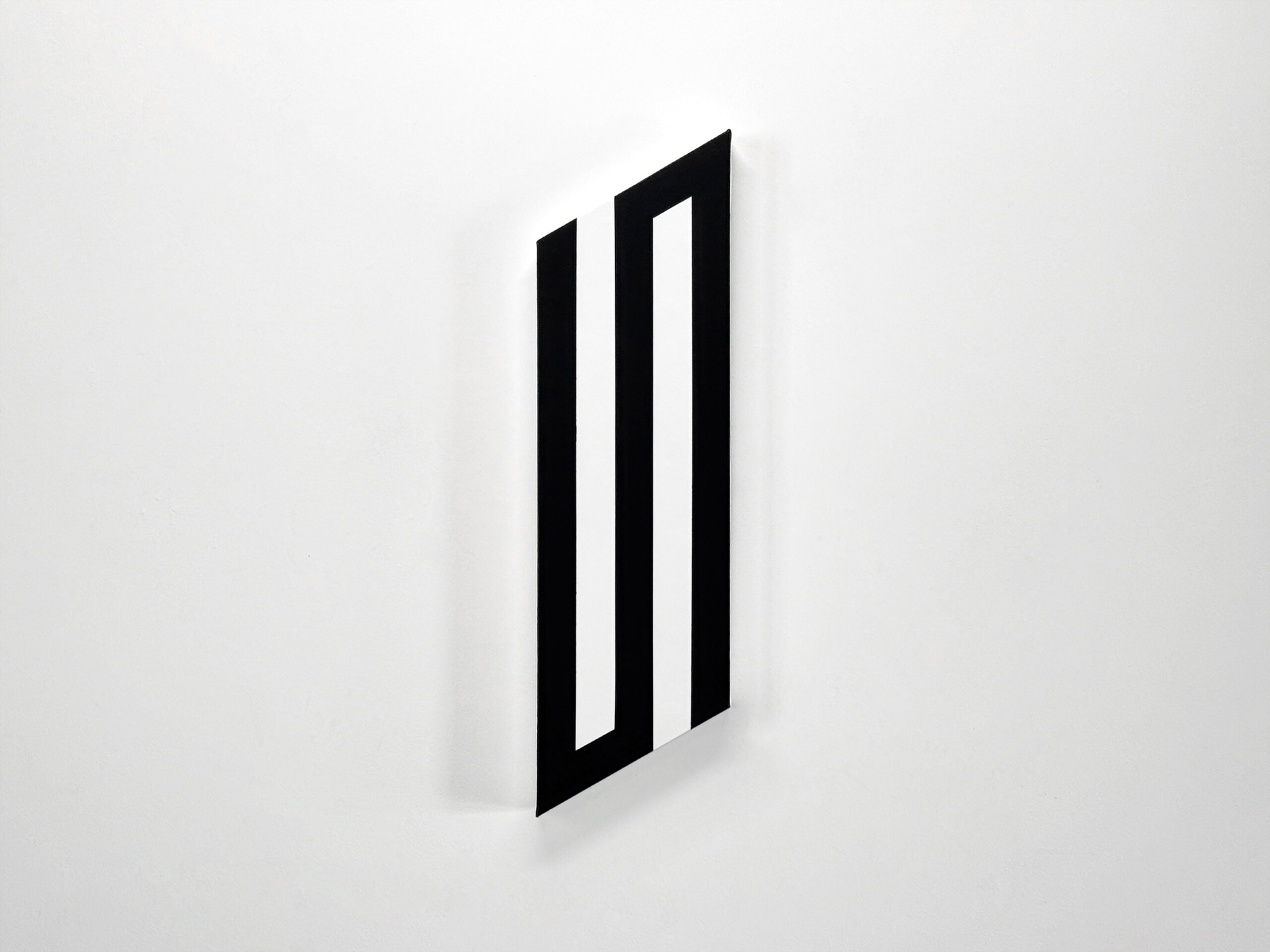 Perspective view of an elongated vertical shaped canvas painting by Jean-Charles Kien on a gallery wall.