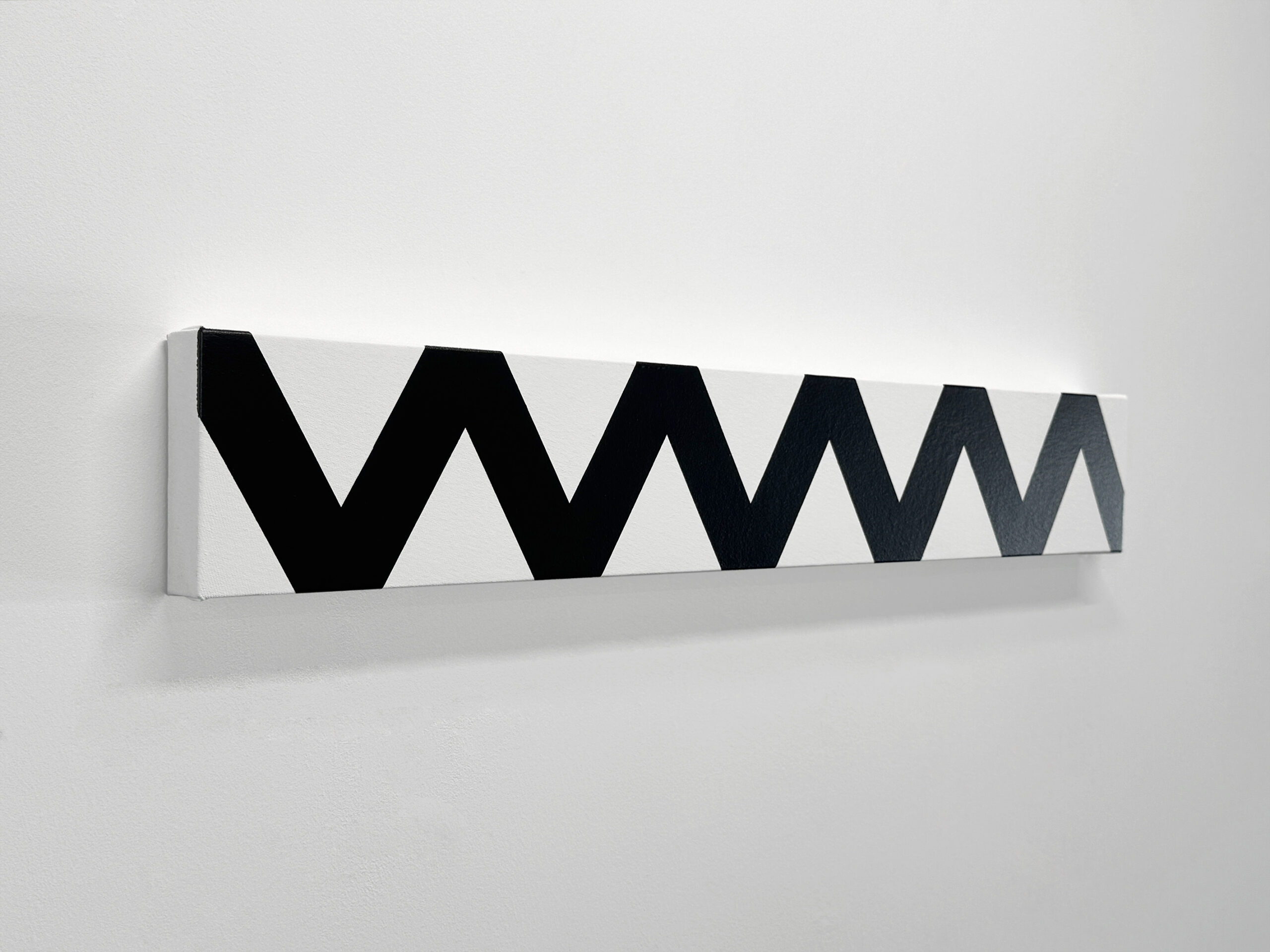 Perspective angle view from the left of Jean-Charles Kien's horizontal minimalist painting with a black wavy zigzag pattern, mounted on a white gallery wall, showing the side profile.